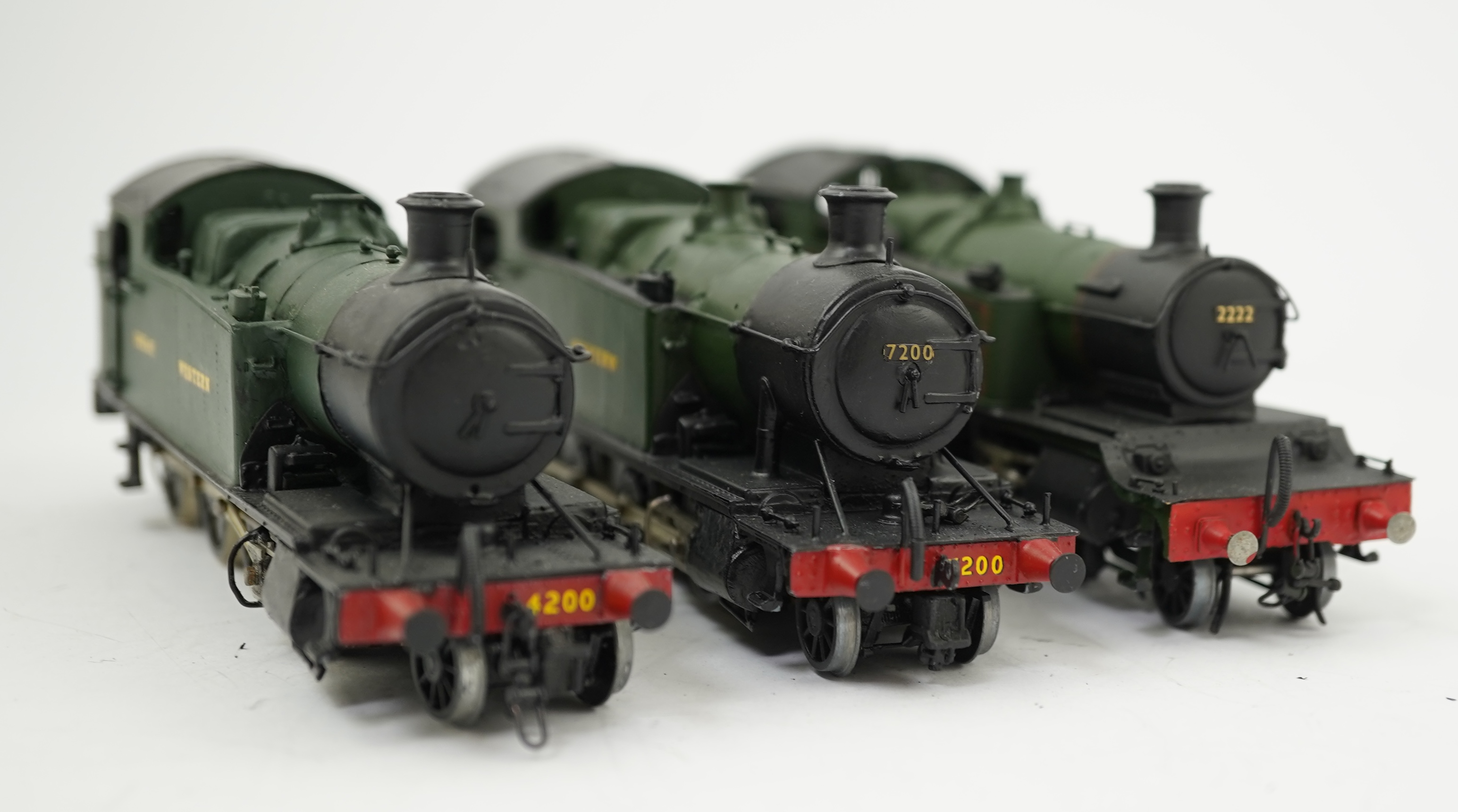 Three 00 gauge kit built GWR tank locomotives, two brass and white metal; a 42xx class 2-8-0T, 4200, together with an 72xx class 2-8-2T, 7200, plus a plastic/resin and metal 22xx class 4-4-2T, 2222, all constructed, pain